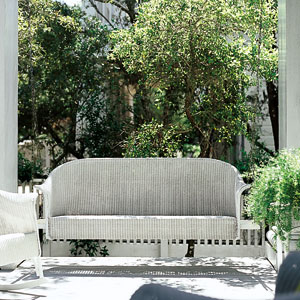 classic white wicker porch swing