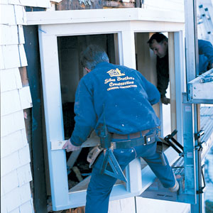 sliding a new bay window into place