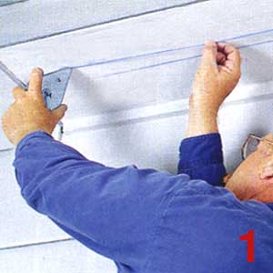 SNAP TWO parallel chalk lines 2 in. apart along the soffit to represent the cutout for the new strip vent.  