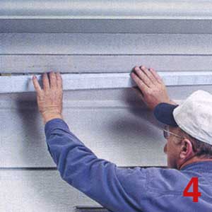 HOLD THE 3-in.-wide strip vent centered over the 2-in.-wide cutout in the soffit. Handle it gently to avoid crimping it. 
