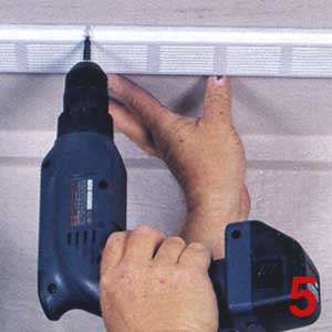 SECURE THE aluminum vent to the plywood soffit with 1/2-in.-long screws spaced 12 to 14 in. apart.