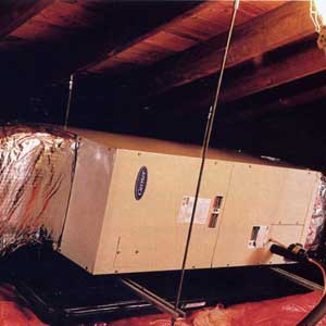 A fan-and-coil system, typically mounted on the attic floor, uses refrigerant piped in from the outside condenser to cool the air. Then the fan blows it through ducting to the rooms below. 