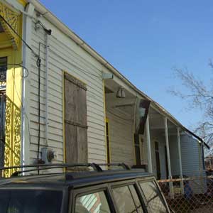 damaged side porch made of cypress