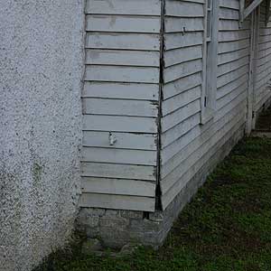 water-damaged cypress siding