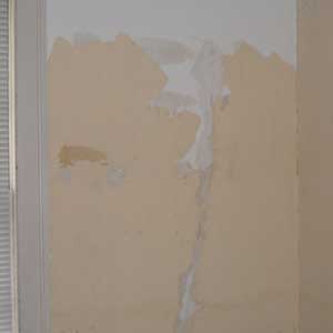 repaired cracks in plaster wall