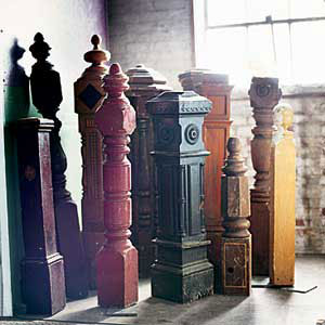 simple, square-topped wood newels versus decorative newels with carved finials
