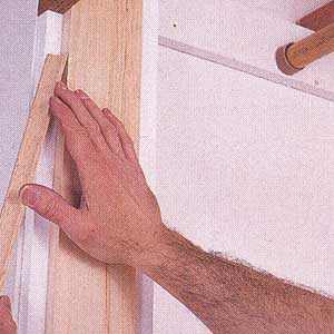 nail a 1x4 to each side jamb of the closet