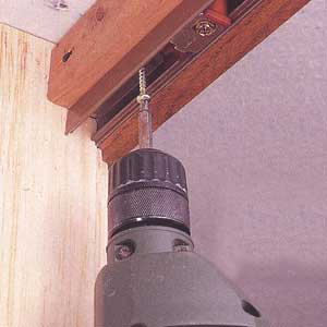 fastening the metal door track