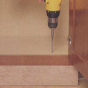 fasten each base cabinet