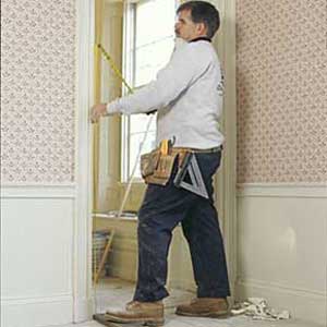 Tom Silva measuring the door 