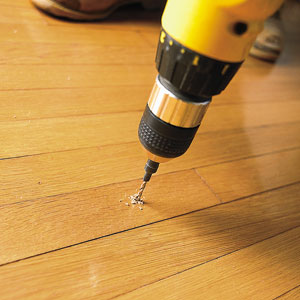 drilling into a wood floor