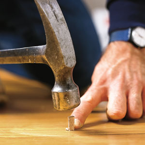 filling a hardwood floor with a wood plug