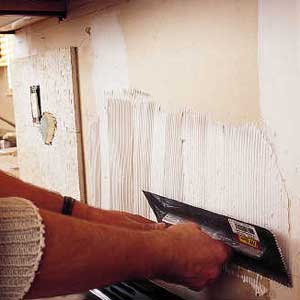 spread mastic install tile