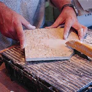 Wet Saw cuts ceramic tile