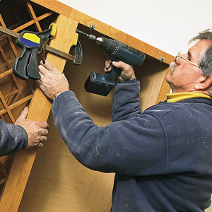 Tom Silva drilling cabinets