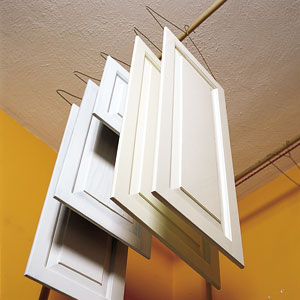 John Dee's ingenius solution for painting both sides of cabinet doors simultaneously; cut down on drying time