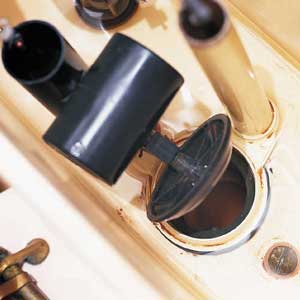 worn rubber flapper valve in a toilet tank