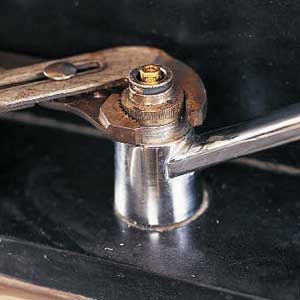 slip-joint pliers to free the retainer nut 