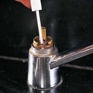 thin-bladed screwdriver to pry out the retaining clip 
