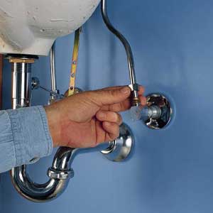 Disconnect the water-supply tube from the old adapter that's attached to the pipe in the wall. 