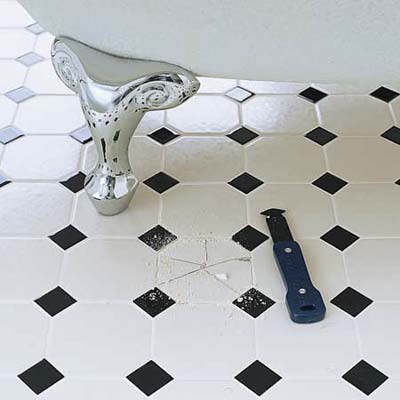 remove the grout with a carbide-tipped scoring tool