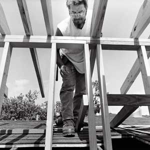 man walking down the roof