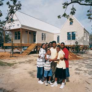 a family standing outside the house
