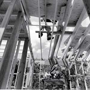 man secures roof rafters