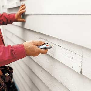 Utility knife to score clapboard