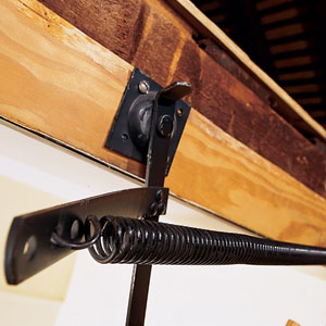 bent pivot arm on pull-down stairs