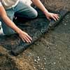 Lay down the landscape fabric