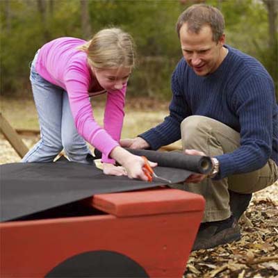 line the inside of the sandbox with fabric