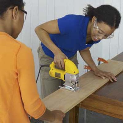 cutting wood to the sizes needed to build a tree swing