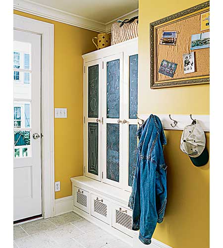 mudroom with shelves, hooks, and a message board