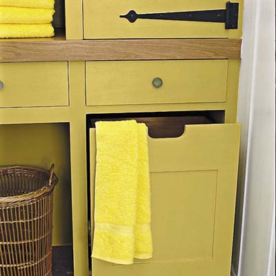 built-in storage unit is fitted with pull-out bins, cabinets and drawers