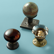 glass doorknobs seen in speckled globe, jewel toned and vintage classic styles