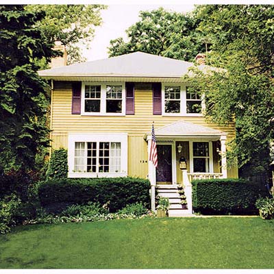 front porch entry, terraced garden and facade