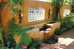 Stone fountain and ironwork screen
