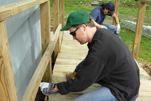 John Taylor & Timothy Dahl working at Americares Homefront Day