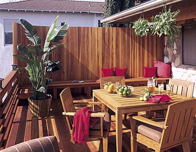 A deck with redwood staves for a privacy wall