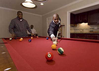 NBA star Chris Paul shoots pool