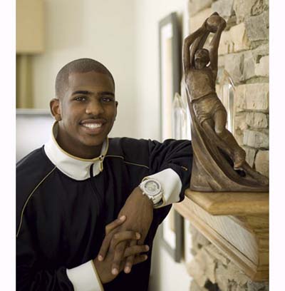 NBA star Chris Paul leaning on mantel