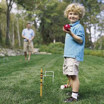 boy holding croquet ball
