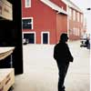Norm Abram pauses to look around at lumberyard