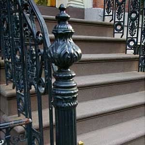 Stairs doused in ornamental cast-iron detail.
