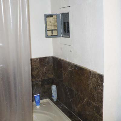 an electrical panel located within a shower area