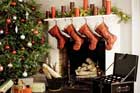xmas tree, stockings over mantel and holiday decoration storage chest