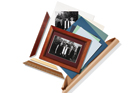 Framed photo of family surrounded by paper and another famil photo