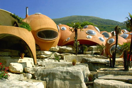 house shaped like bubbles built onto rock surface