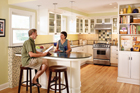 couple sits at their kitchen counter